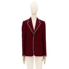 Red blazer with white trim on a mannequin against a white background