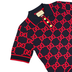 Black sweater with red pattern on a light gray background