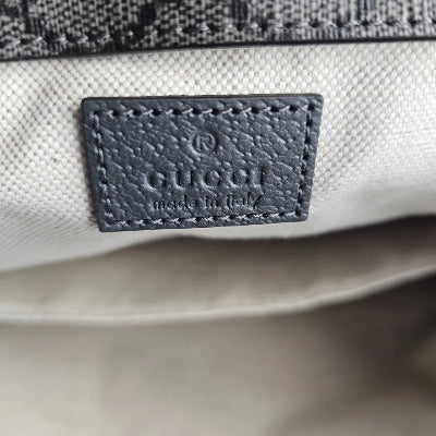 Close-up of a Gucci logo on a product with a blurred background