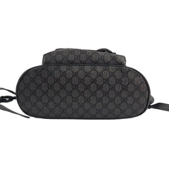 Black patterned handbag on a light gray background