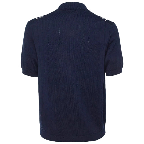 Navy blue polo shirt with buttons on a plain background