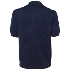 Navy blue polo shirt with buttons on a plain background