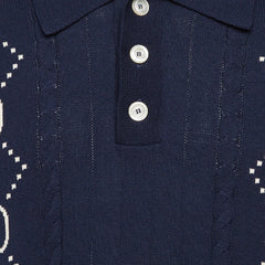 Navy blue fabric with white buttons and patterns