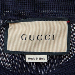 Gucci label on a textured fabric background