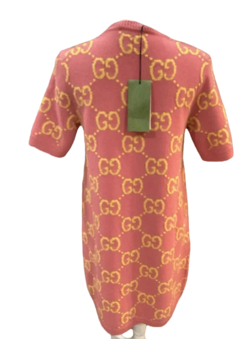 Red baby outfit with gold pattern on a gray background