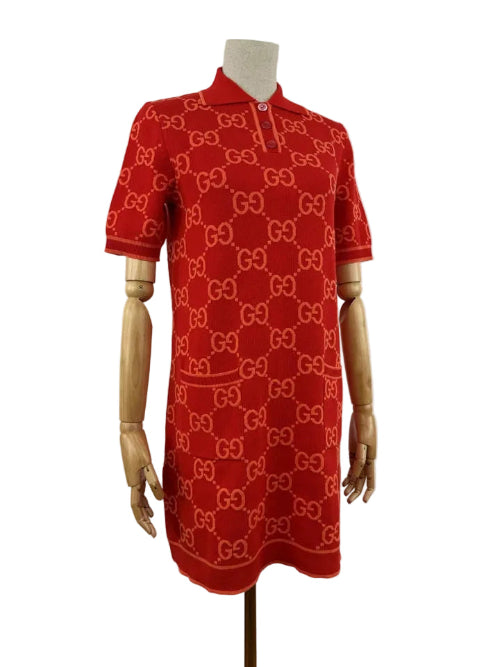 Red dress with a pattern on a mannequin against a white background