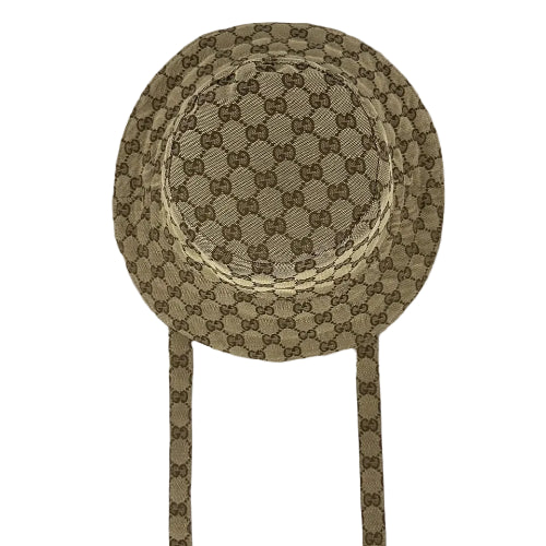 Decorative headband with circular pattern on a beige fabric background