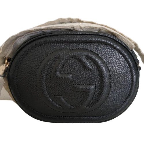 Black leather Gucci bag with beige strap on a white background