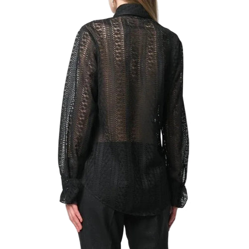 Black lace top worn by a person on a white background