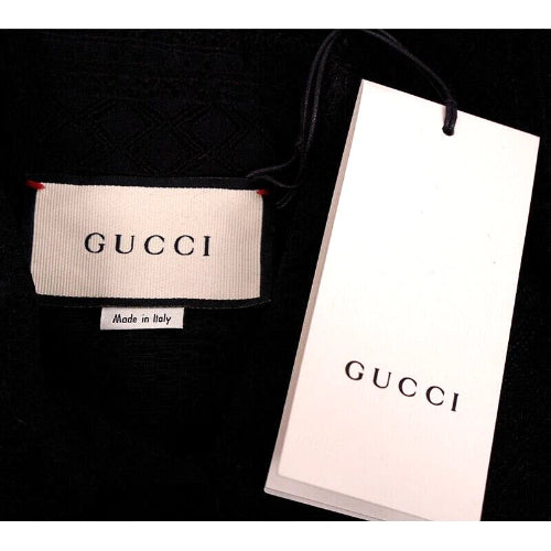Gucci label and packaging on a black background