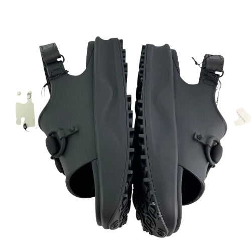 Pair of black diving fins on a white background
