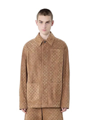 Man wearing a brown patterned jacket and pants on a white background