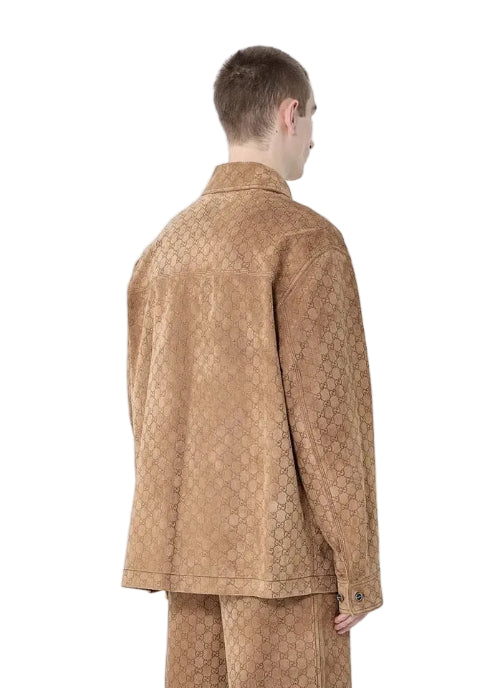 Person wearing a patterned outfit against a plain background