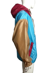 Colorful poncho with a hood on a plain background