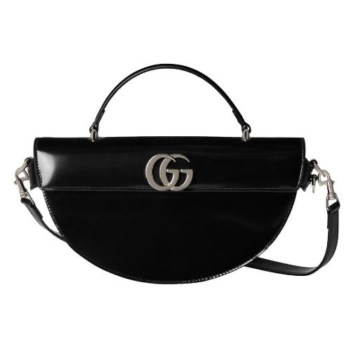 Black handbag with a prominent logo on a white background