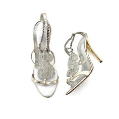 Pair of silver high-heeled shoe earrings on a white background