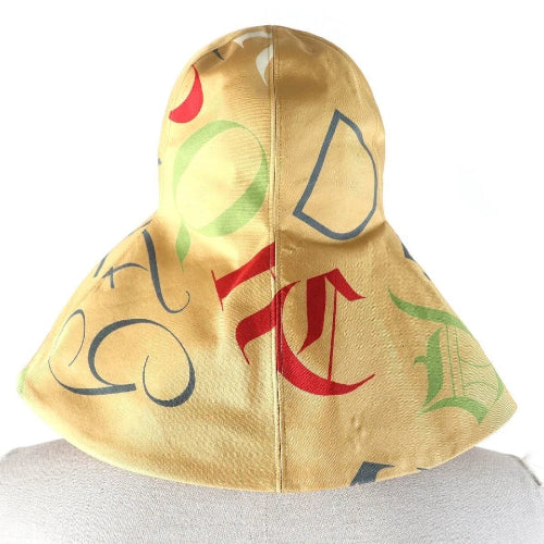 Colorful hood with abstract designs on a plain background