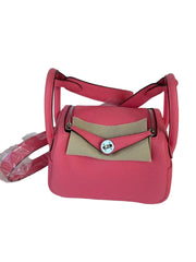Red handbag with beige flap on a white background