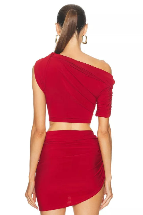 Red one-shoulder top and skirt set on a white background