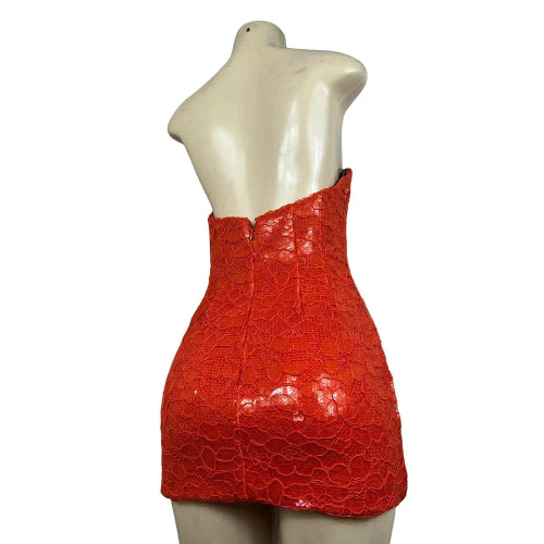 Red strapless dress on a mannequin against a white background