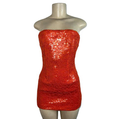 Red sequin dress on a mannequin against a white background
