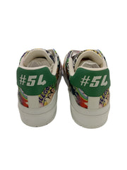 Pair of sneakers with colorful patterns and green accents on a white background