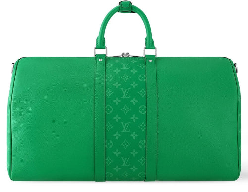 Green travel bag with monogram pattern on a white background