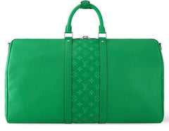 Green travel bag with monogram pattern on a white background
