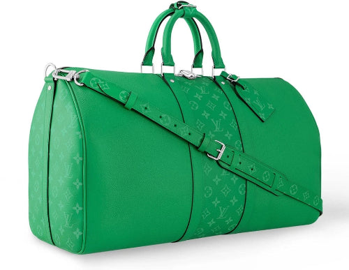 Green duffel bag with monogram pattern on a white background