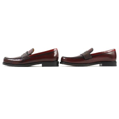 Pair of brown loafers on a white background