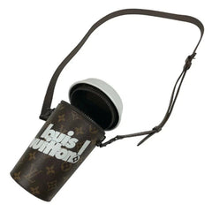 Louis Vuitton camera lens case with strap on a white background