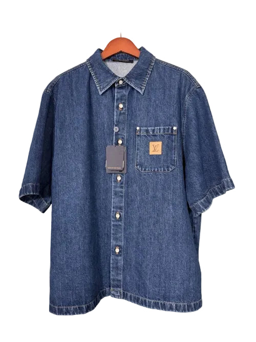 Denim shirt on a hanger with a visible brand tag.