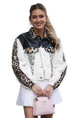 Woman wearing a leopard print and white jacket with a pink handbag.