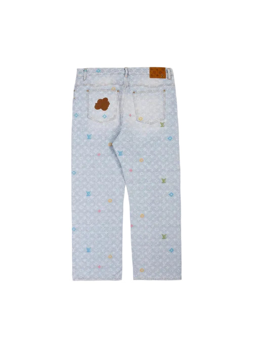 Light blue denim jeans for kids, featuring a subtle all-over pattern of small stars and dots, a brown leather patch on the back waistband, and a small embroidered brown bear patch on the right back pocket.