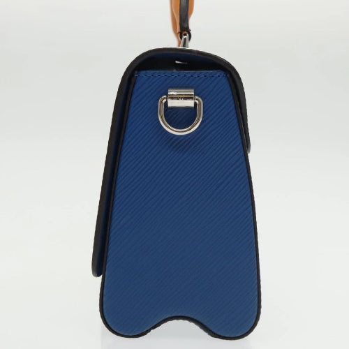 Blue saddle pad with a silver buckle on a white background