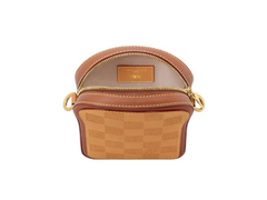 Brown patterned handbag with gold zipper on a white background