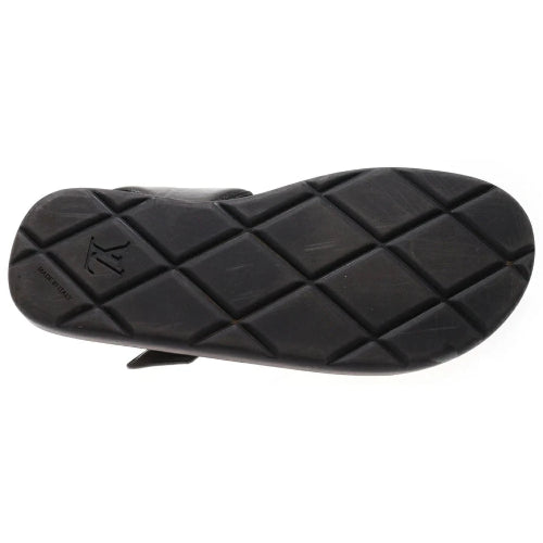 Black sandal sole with a diamond pattern on a white background