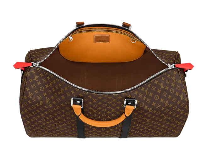 A Louis Vuitton monogram duffel bag shown open against a light gray background, featuring a brown coated canvas exterior with the classic monogram pattern, a bright orange interior lining, orange leather handles, and silver zippers.