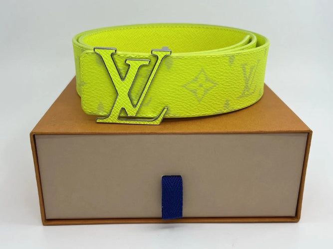 Neon green belt with LV logo on a brown box