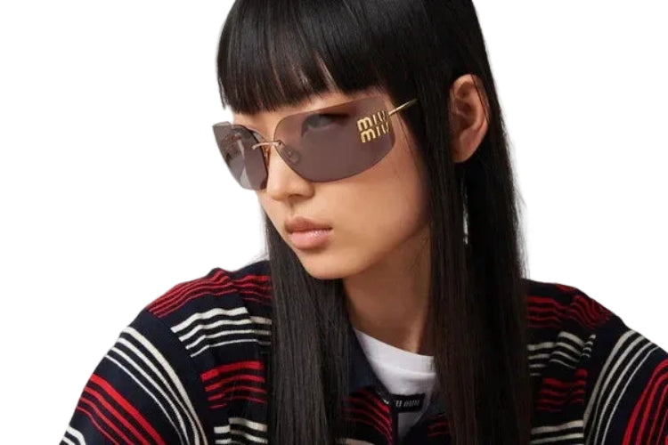 Person wearing sunglasses and a striped sweater with a blurred background