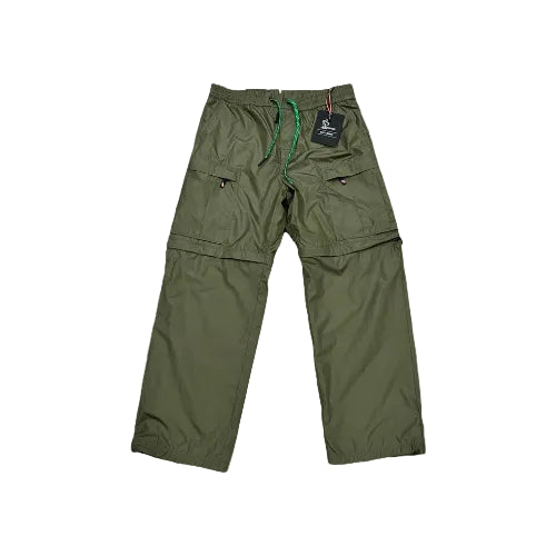 Green pants with a tag on a white background