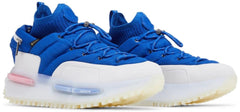 Blue sneakers with white soles on a white background