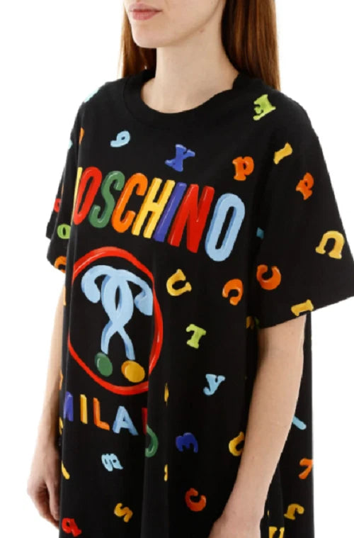 Black t-shirt with colorful graphics and text, featuring a recognizable brand logo.