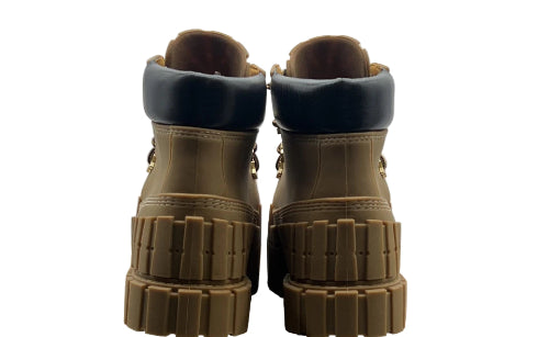 Pair of brown boots on a cardboard box with visible branding.