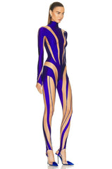 Model wearing a purple and beige bodysuit on a white background