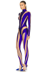 Model wearing a purple and beige bodysuit on a white background