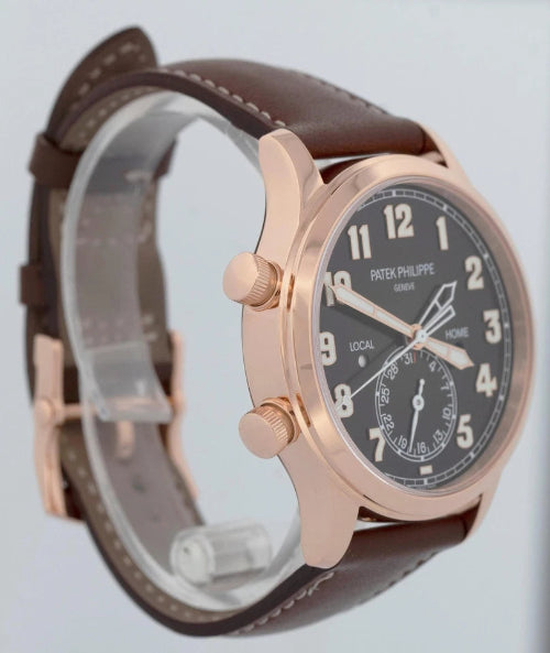 Watch with brown leather strap and rose gold case on a white background