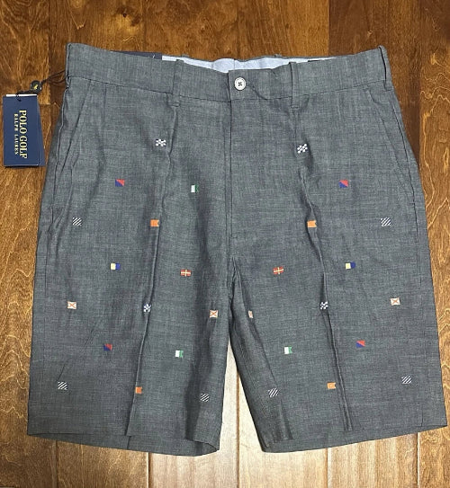 Gray shorts with small decorative elements on a wooden surface