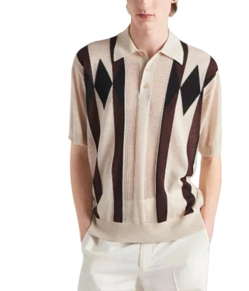 Person wearing a patterned shirt with brown and black diamond shapes on a white background