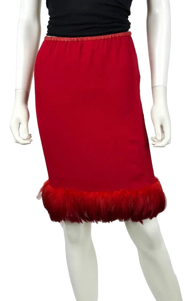 A red knee-length skirt with a feathered hem, displayed on a white mannequin against a plain white background.